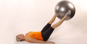 Holding the gym ball between the raised legs develops lower pressure
